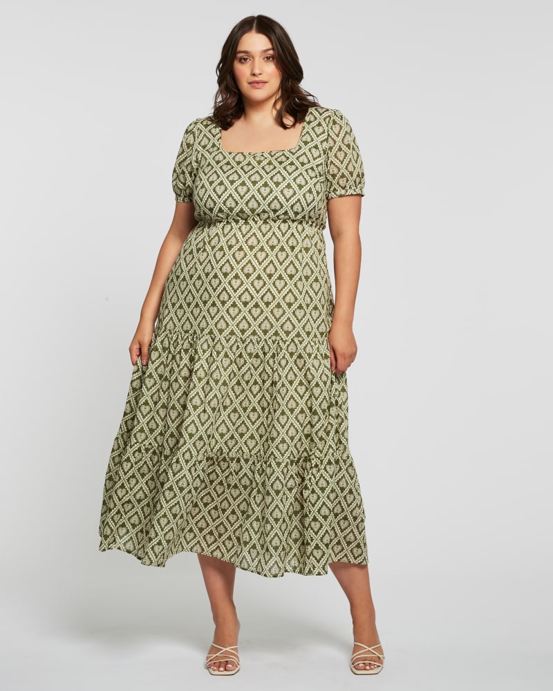 Front of a model wearing a size 4X Olive Heart Maxi Dress in Print by Estelle. | dia_product_style_image_id:264430